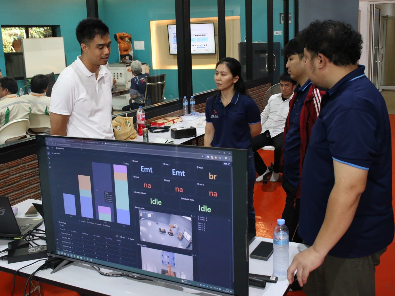 Visitors watching the live Nara dashboard of the robot showcase